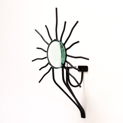 Sunburst wall sconces in the style of Andre Dubreuil