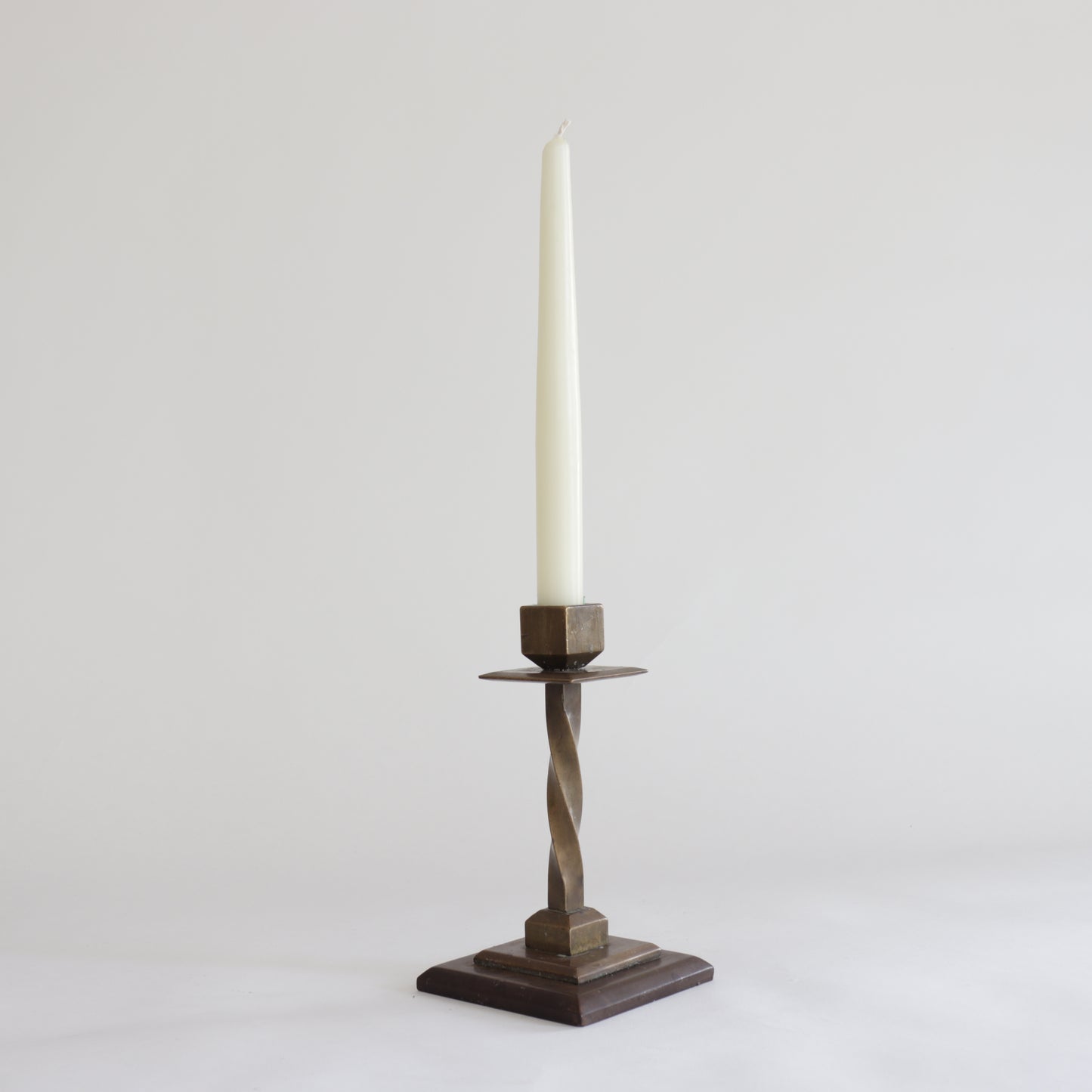 Heavy twisted bronze candlestick