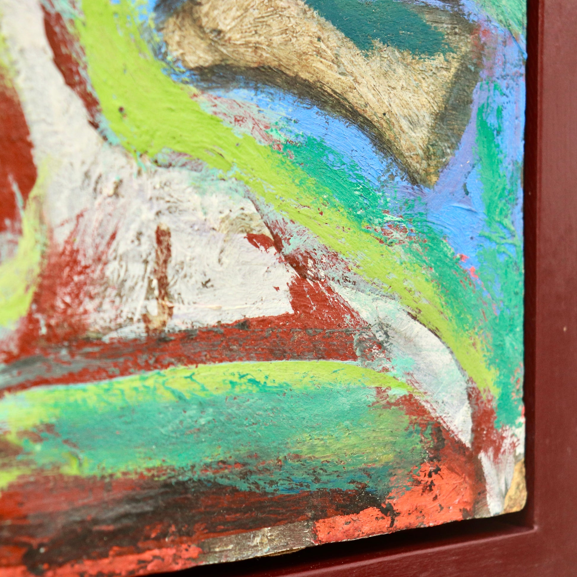 Framed abstract painting with red wooden surround