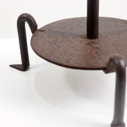 Textured antique iron candle holder surface