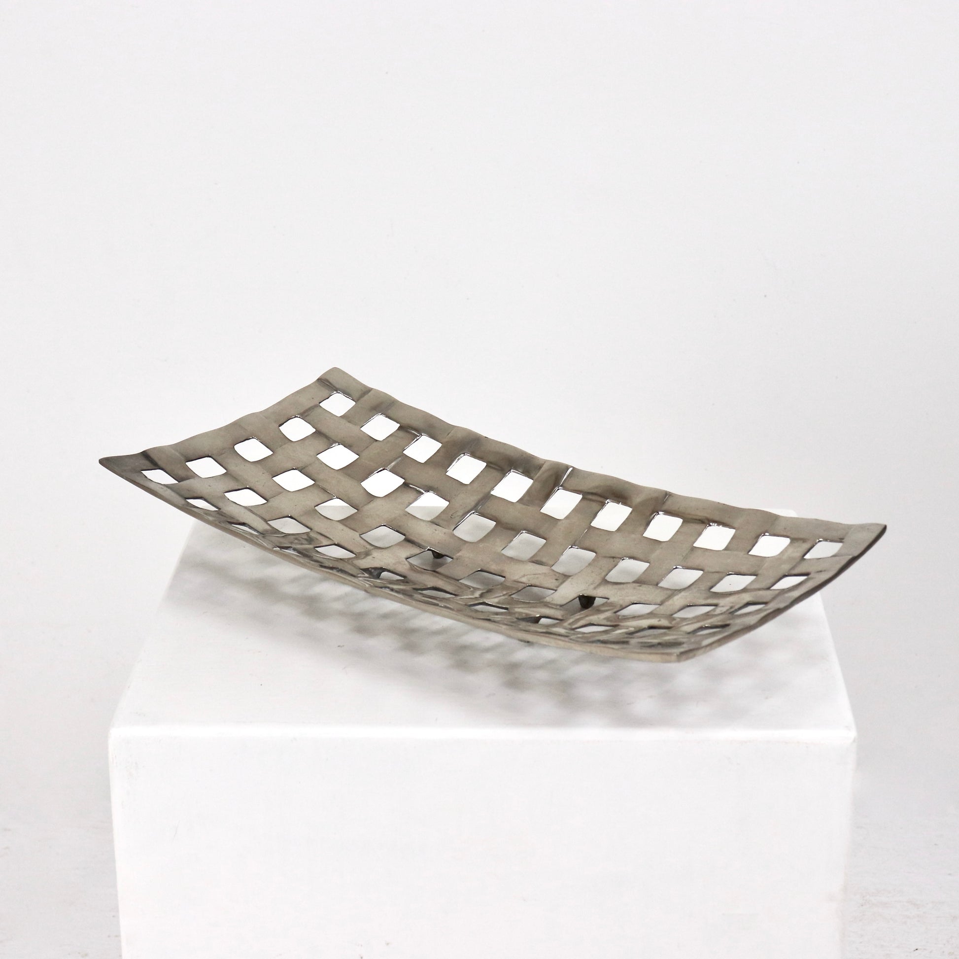 Side profile of cast aluminium woven basket with raised feet