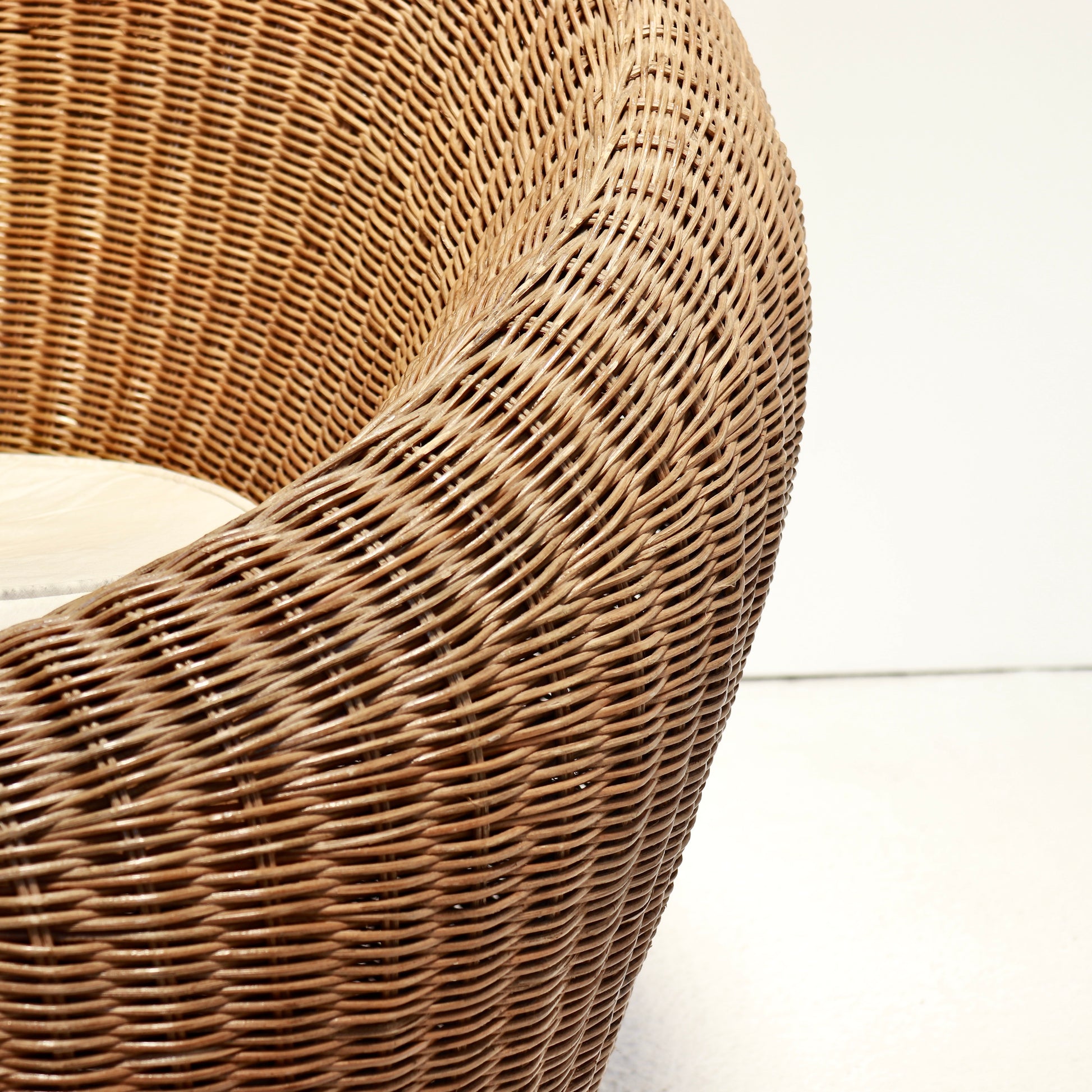 Interior of rattan chair showing circular woven seat base