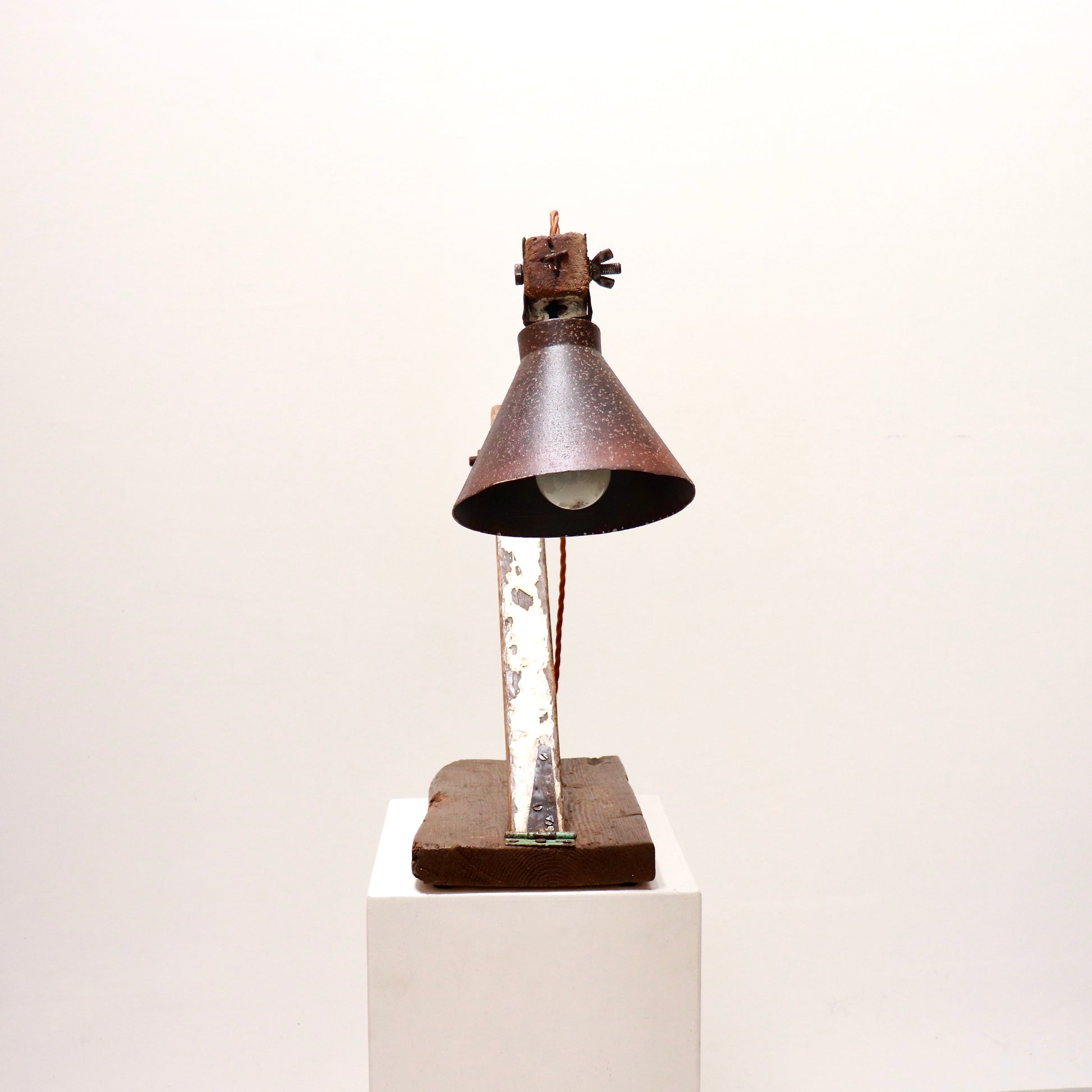 Front view of sculptural handmade anglepoise lamp