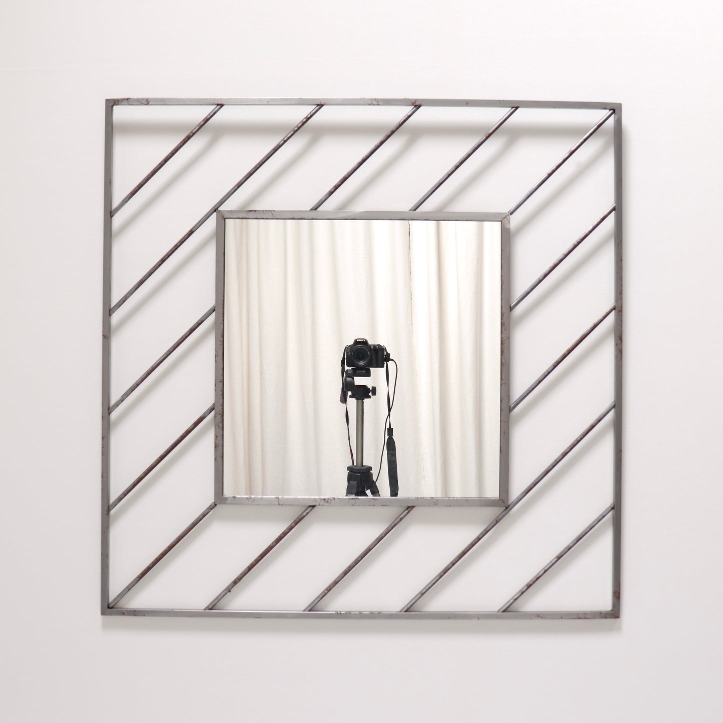 Postmodern steel mirror