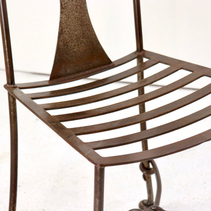 Twisted iron uprights and slatted seat detail