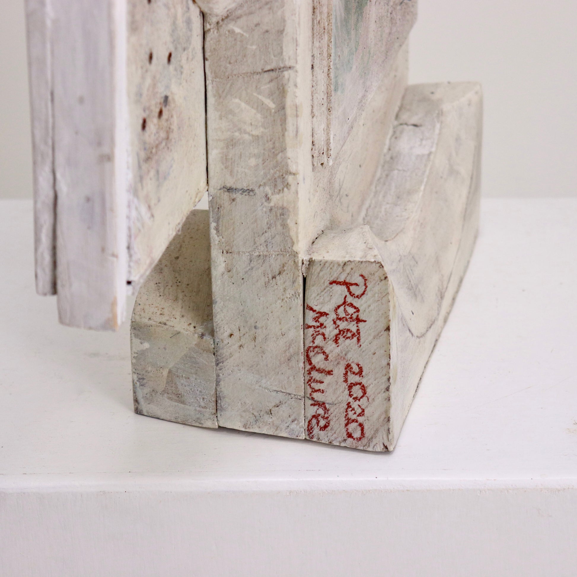 Signature detail on side of sculpture base