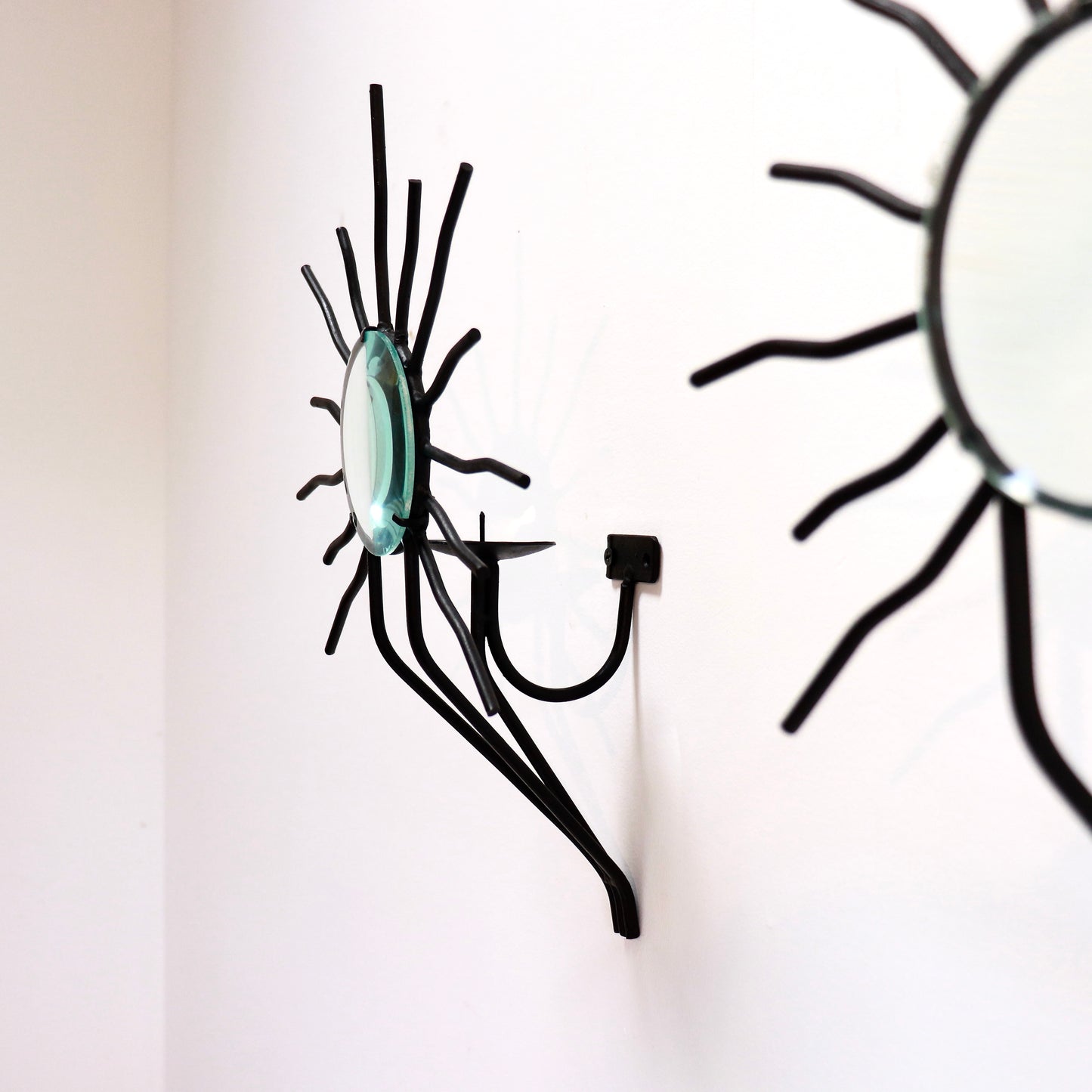 Sunburst wall sconces in the style of Andre Dubreuil