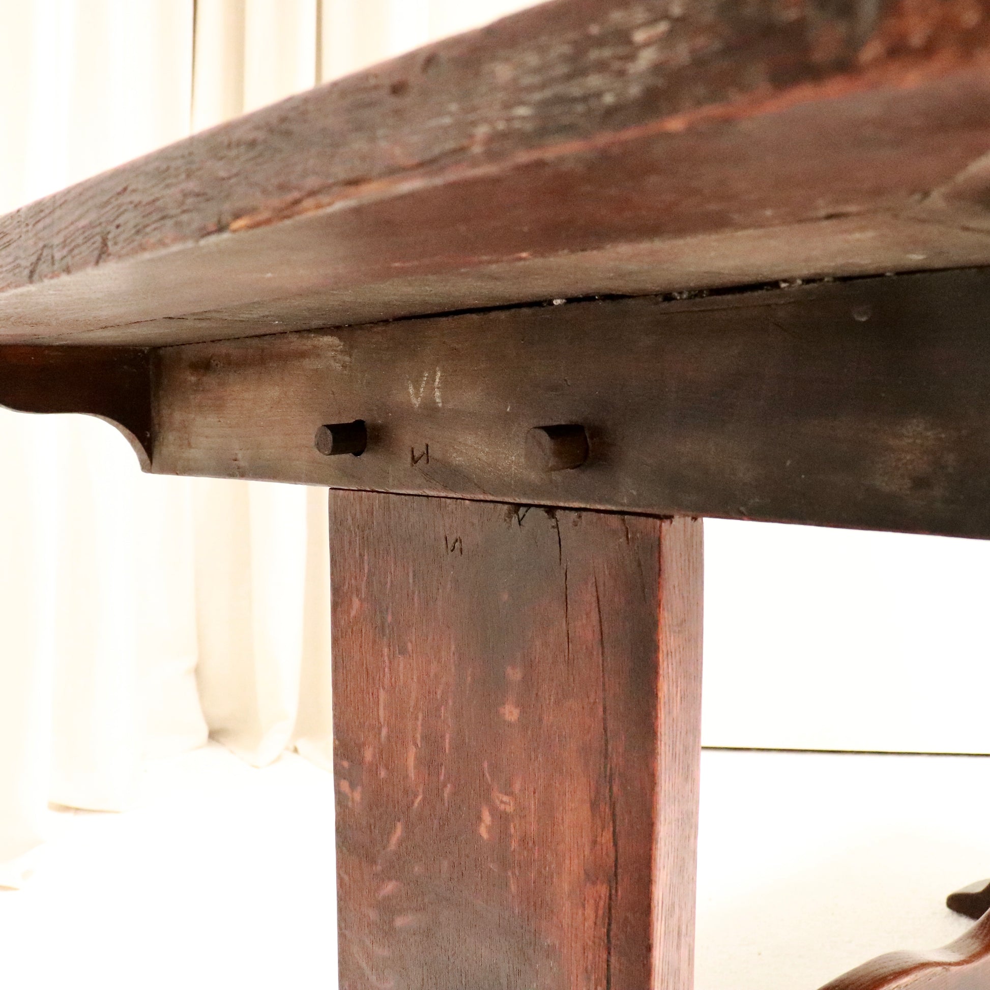 Close-up of pegged mortise-and-tenon joint on trestle end.