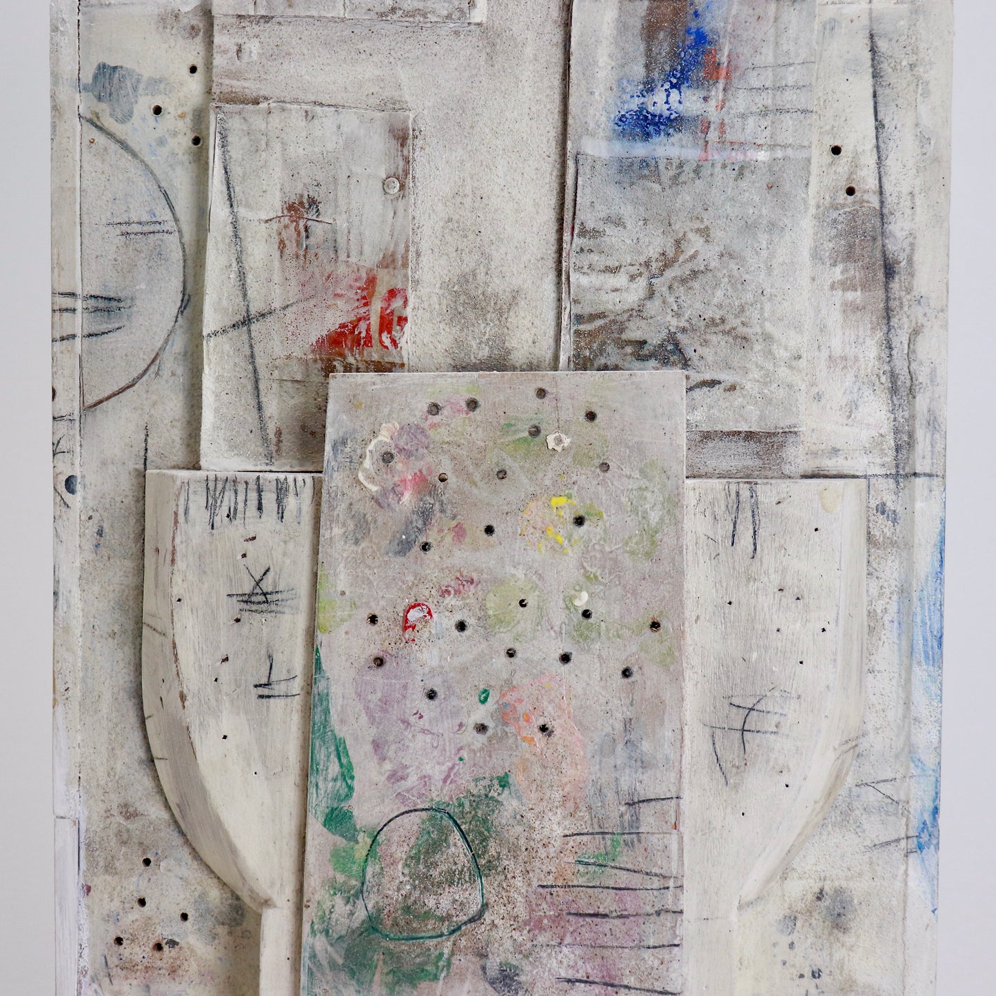 Textured surface with marks, pigments and collaged elements