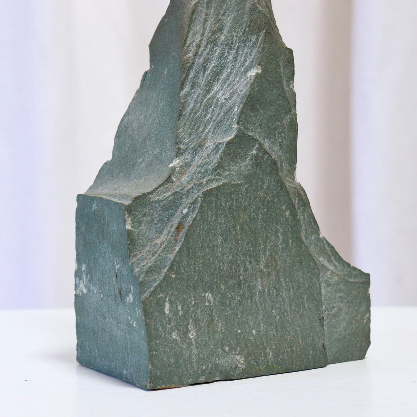 Detail of raw carved slate surface on lamp base