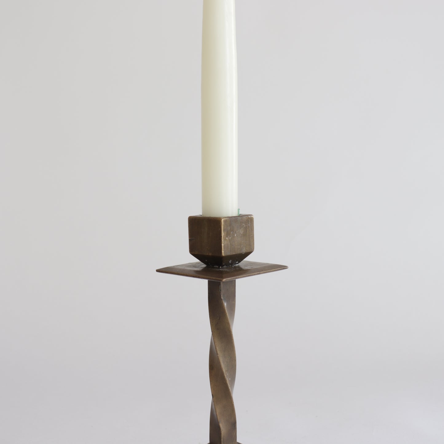 Heavy twisted bronze candlestick