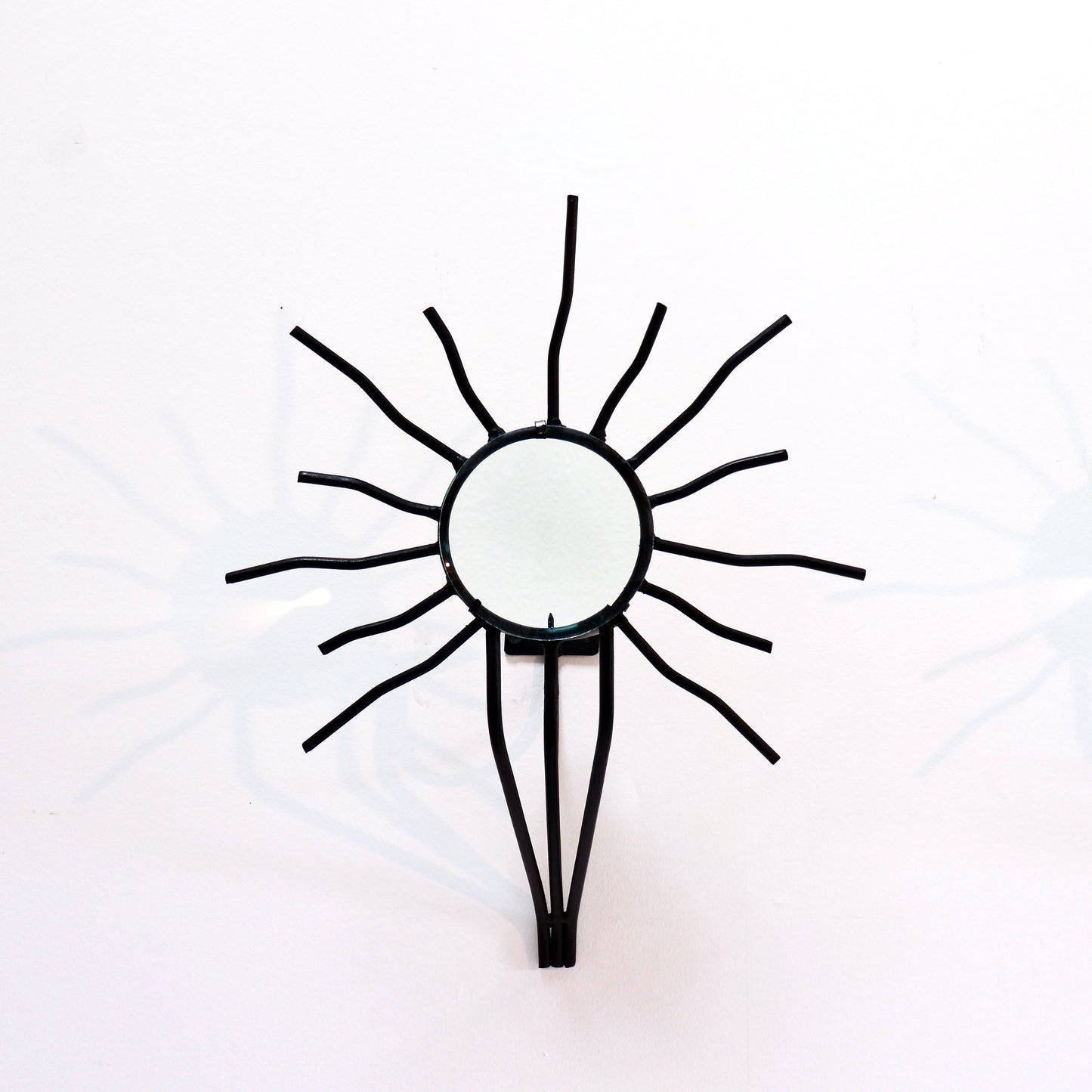 Sunburst wall sconces in the style of Andre Dubreuil