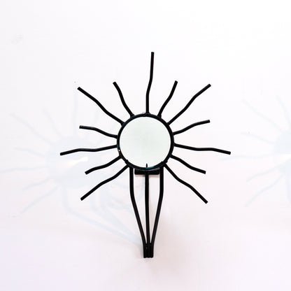 Sunburst wall sconces in the style of Andre Dubreuil