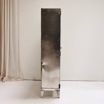 Side profile of vintage aluminium naval storage cupboard.