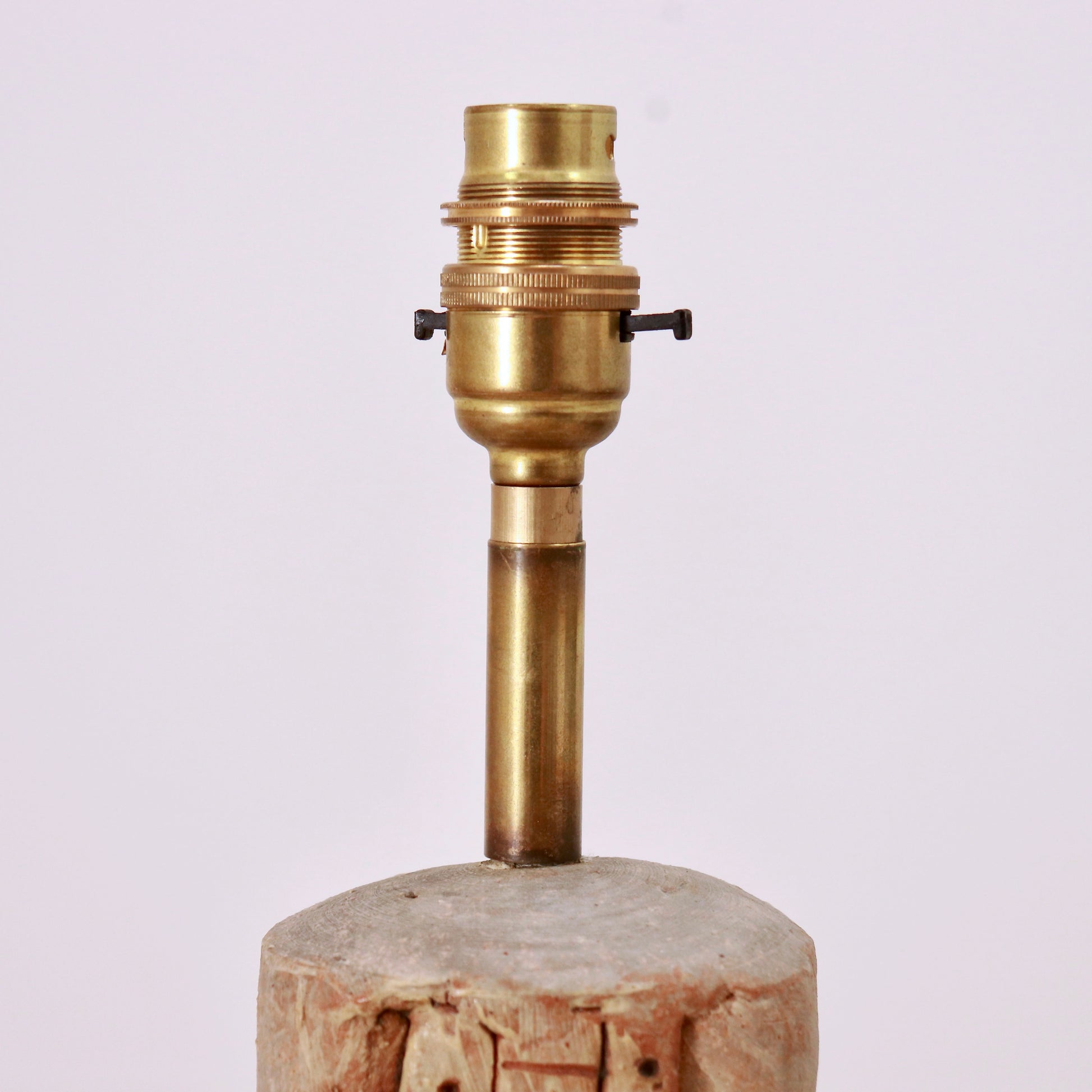 Brass lamp holder and stem on Bernard Rooke pottery base, detail