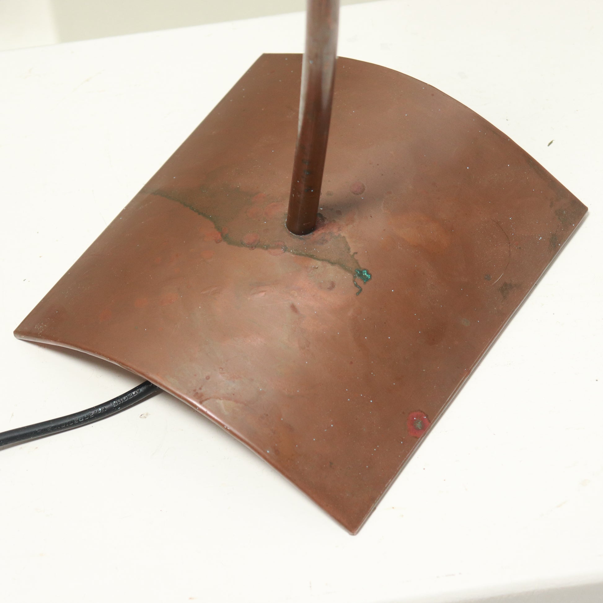 Detail of copper stem and patinated base