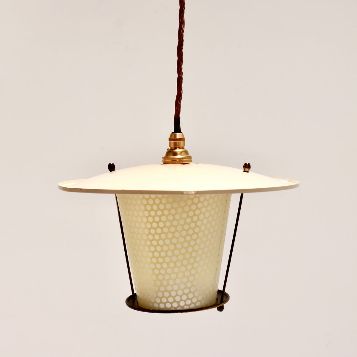 Petite French pendant light with a broad cream enamel shade, tapered dotted glass and brass details.