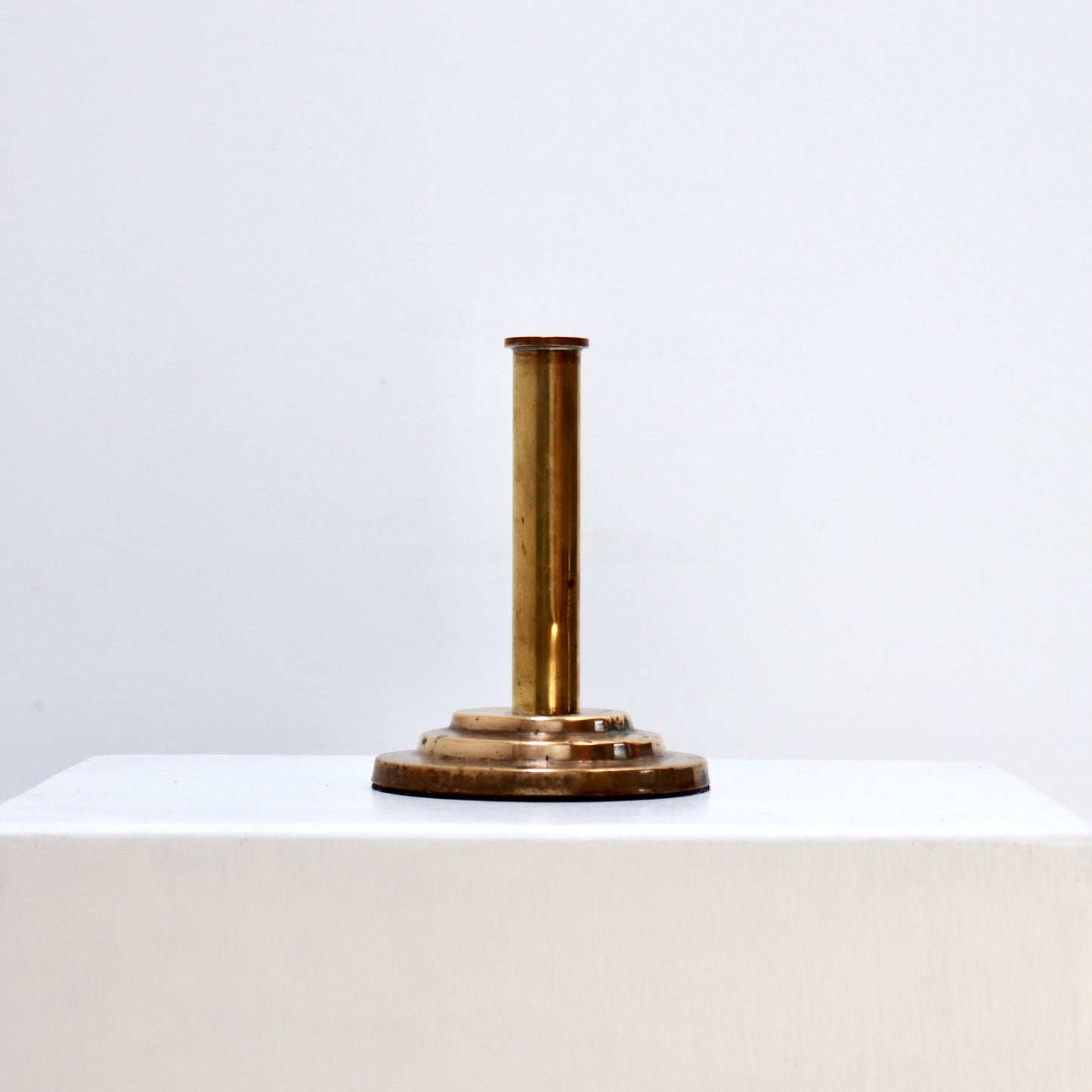 Minimalist brass bud vase with stepped base