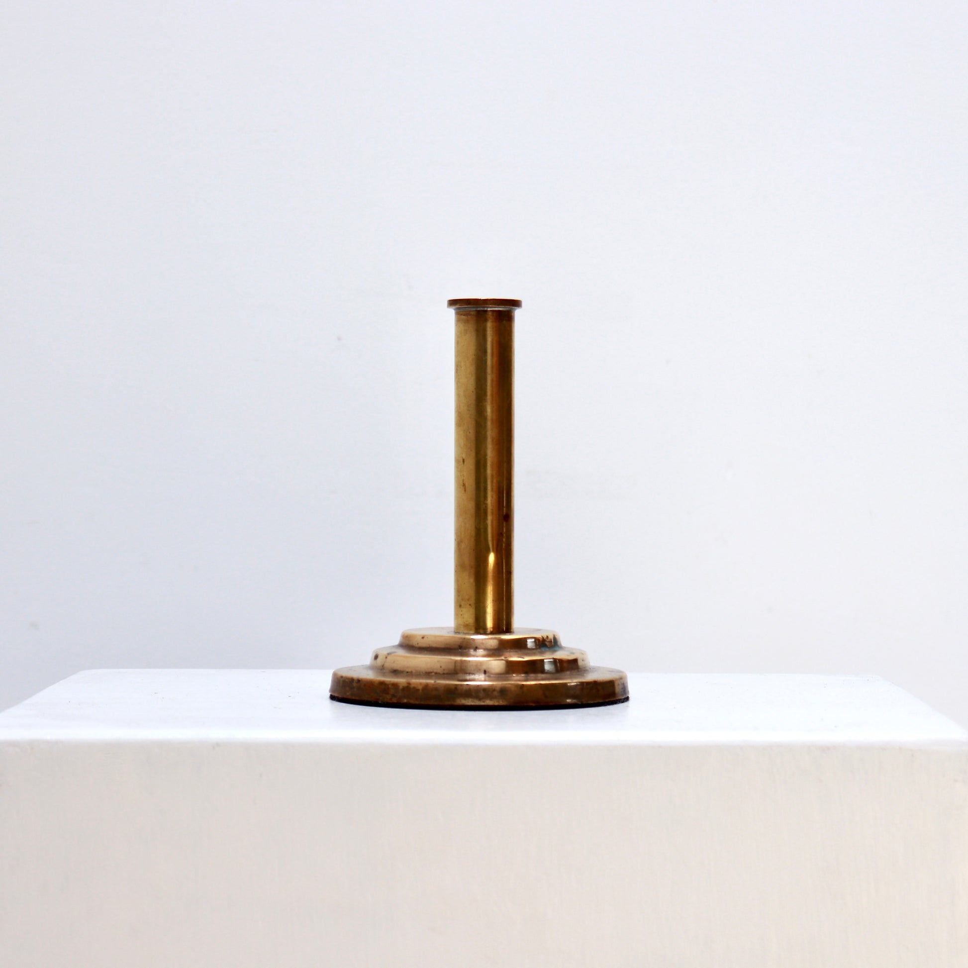 Minimalist brass bud vase with stepped base