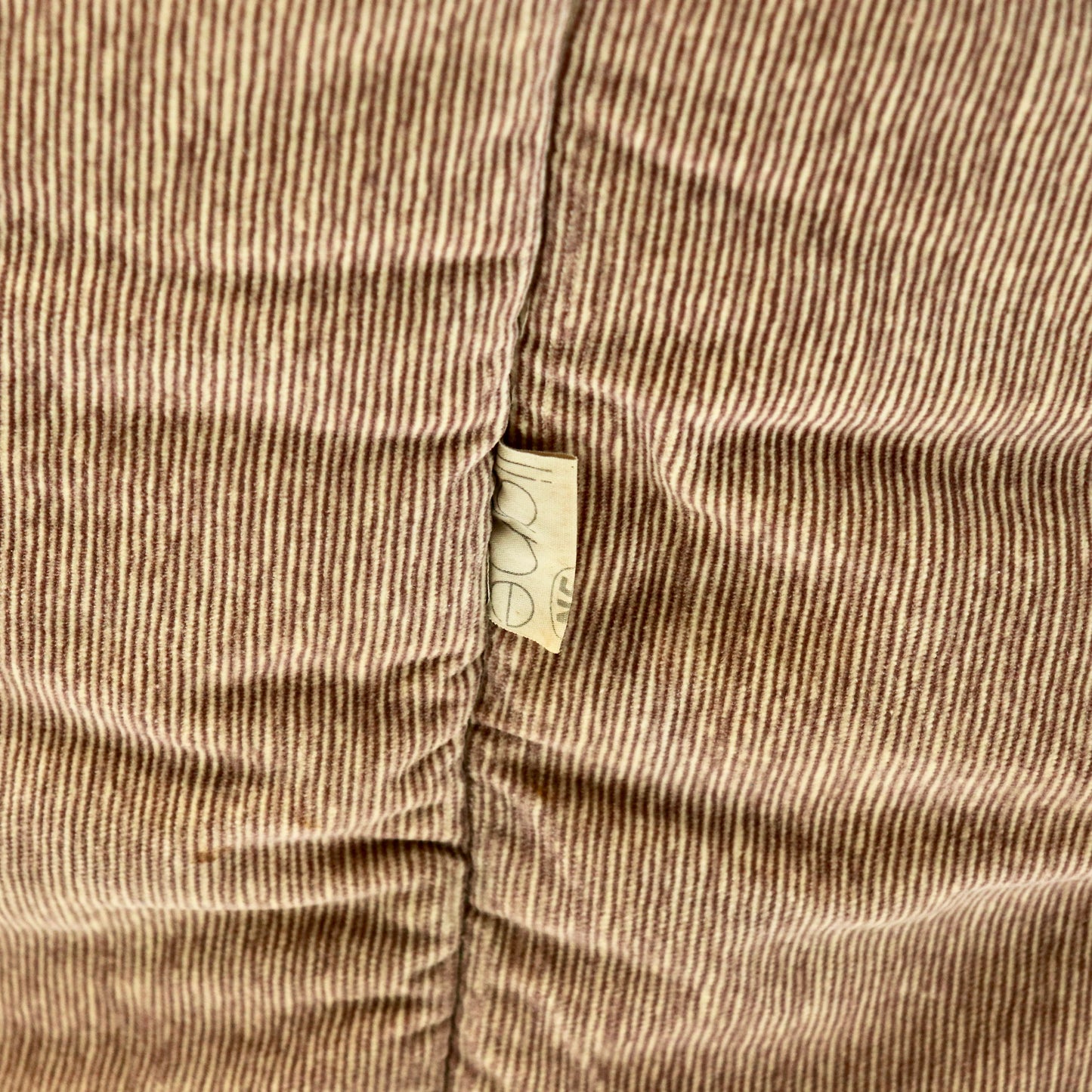 “Roset maker’s label on side seam of Ligne Roset Brigantin armchair.”