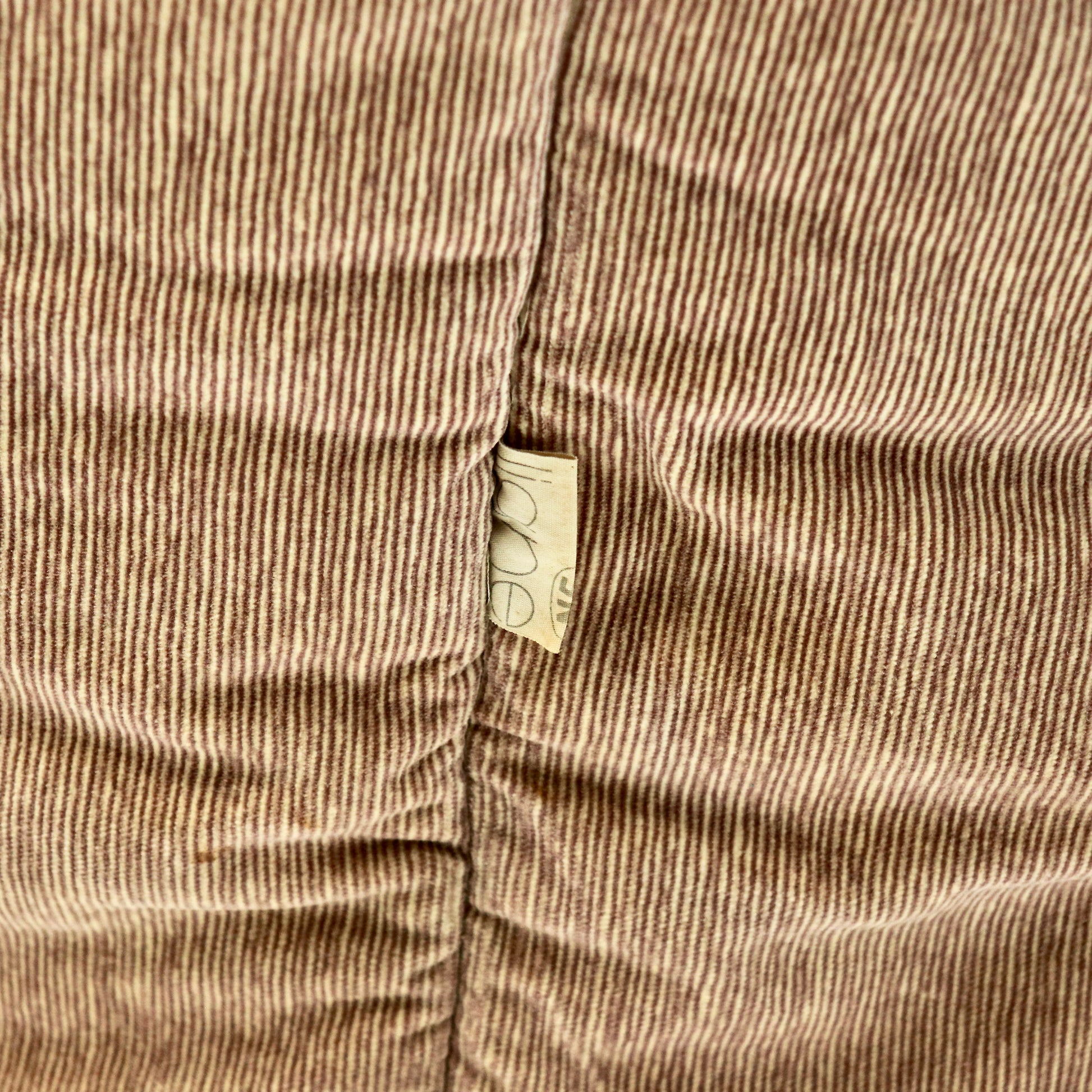 “Roset maker’s label on side seam of Ligne Roset Brigantin armchair.”