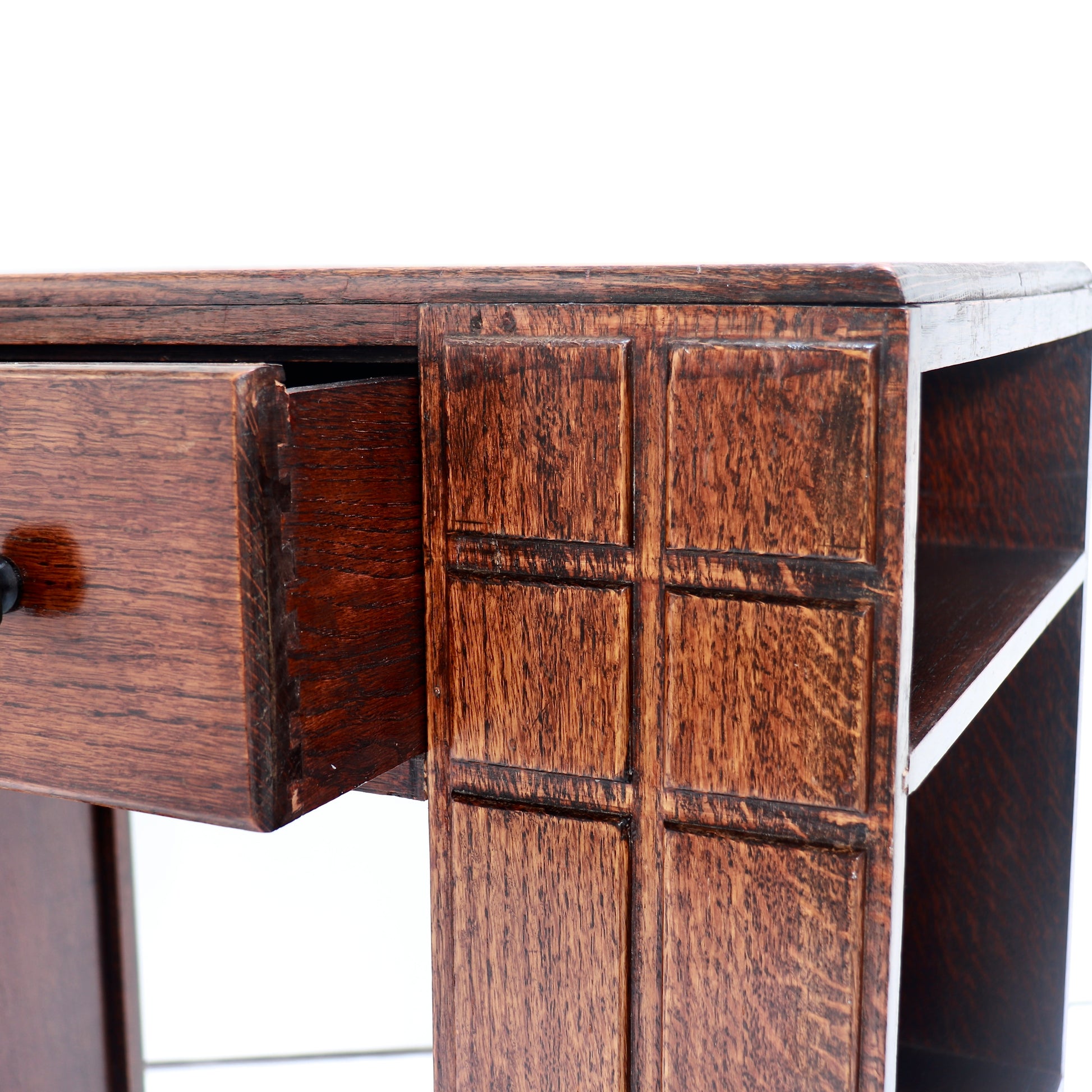 Oak kneehole desk showing geometric detailing