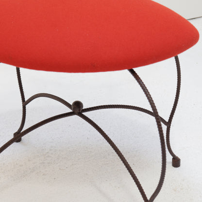 Red wool upholstered seat on blacksmith-made chair