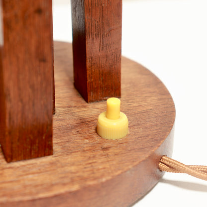 Detail of the circular oak base and small switch