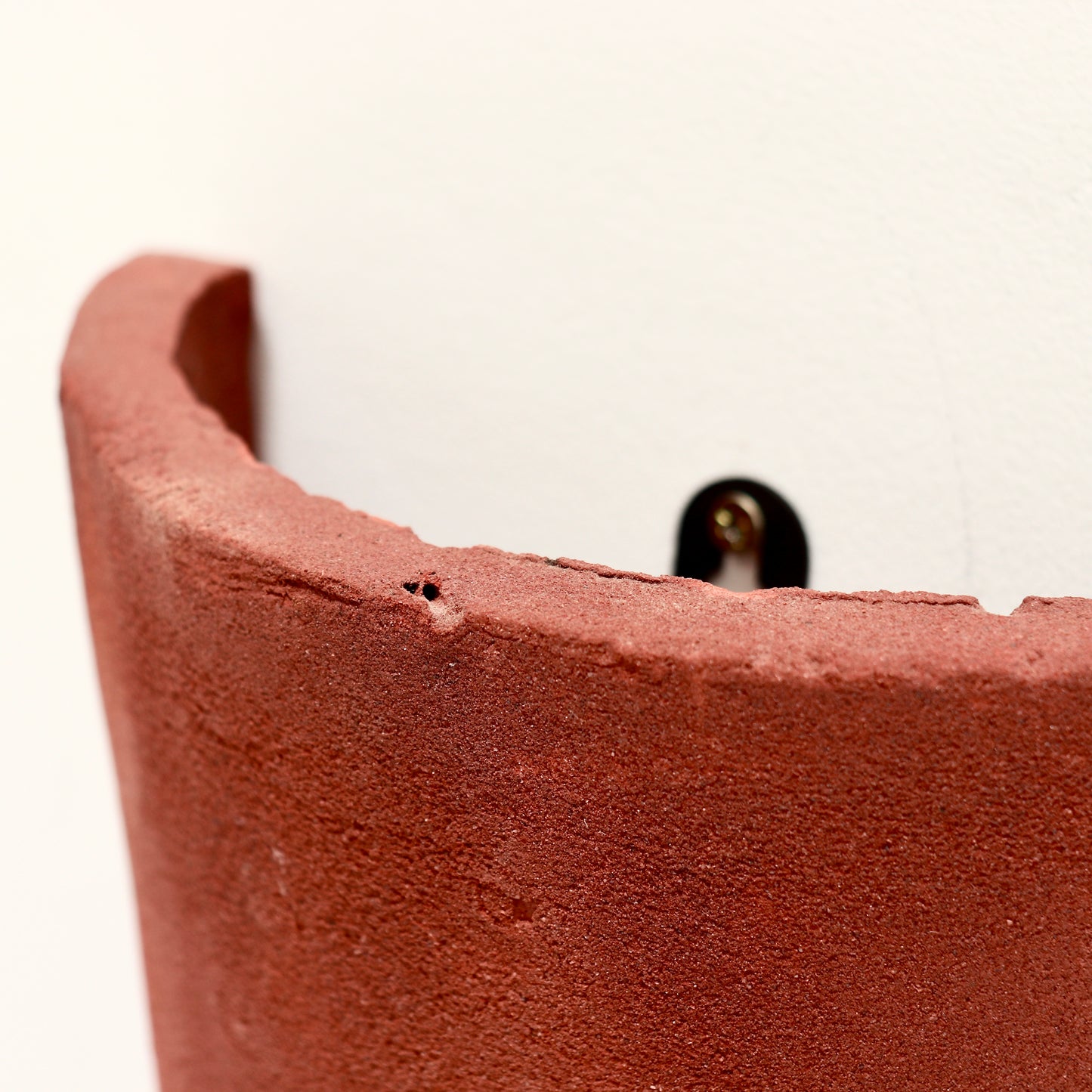 Detail of textured clay surface and patina
