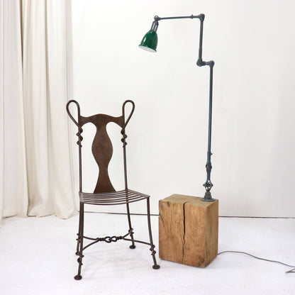 Full height view of vintage machinist lamp on oak base