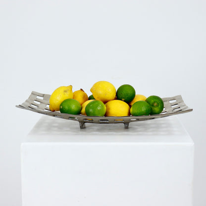 Aluminium openwork fruit basket styled with lemons and limes