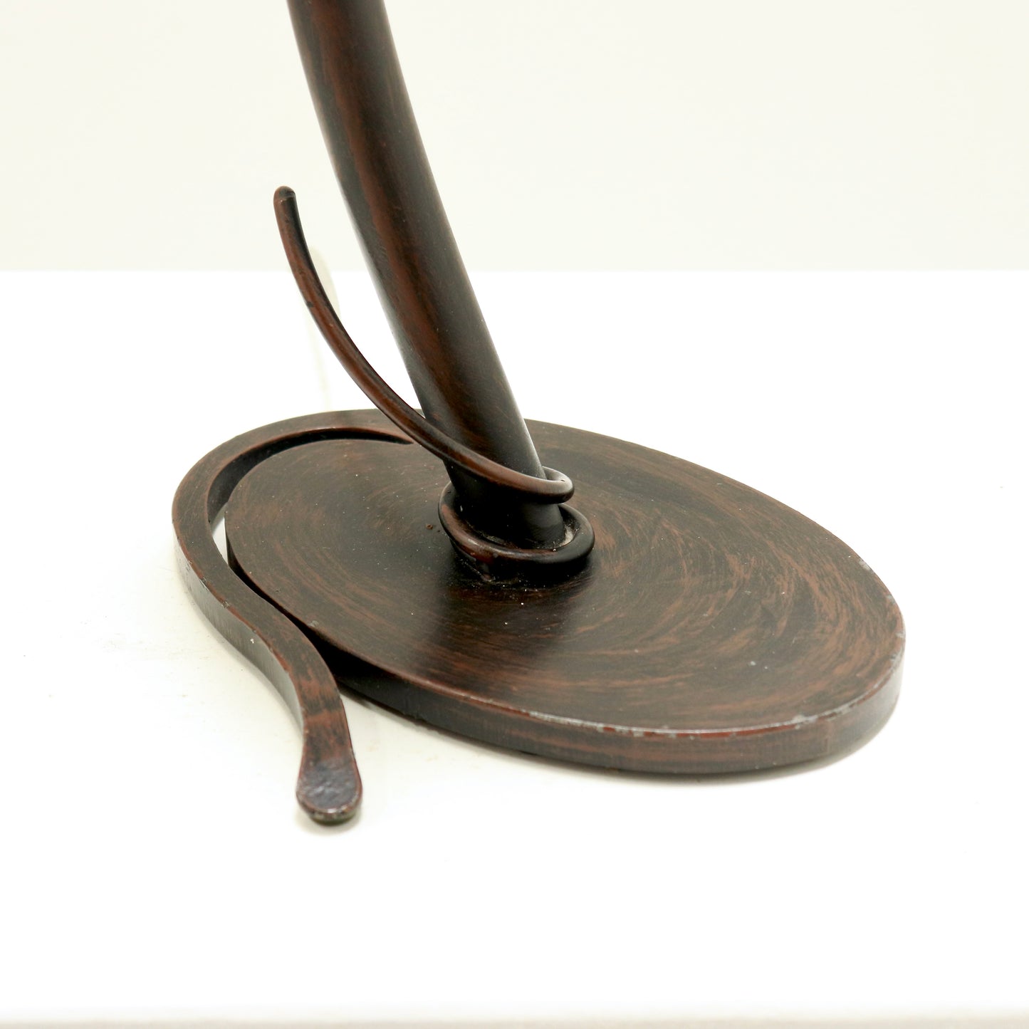 Base detail showing forged iron and patina.