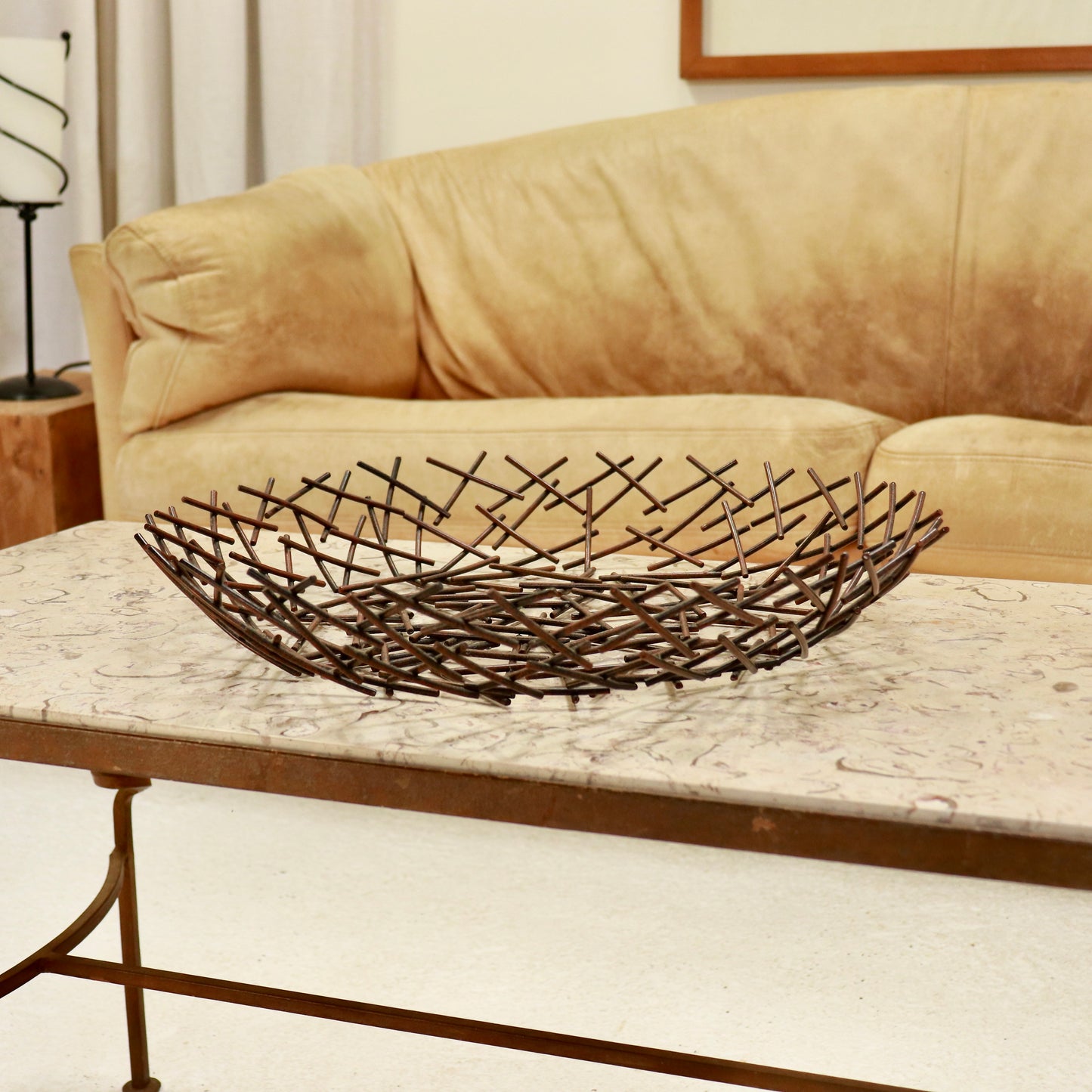 “Post-modern lattice metal centrepiece bowl on coffee table”