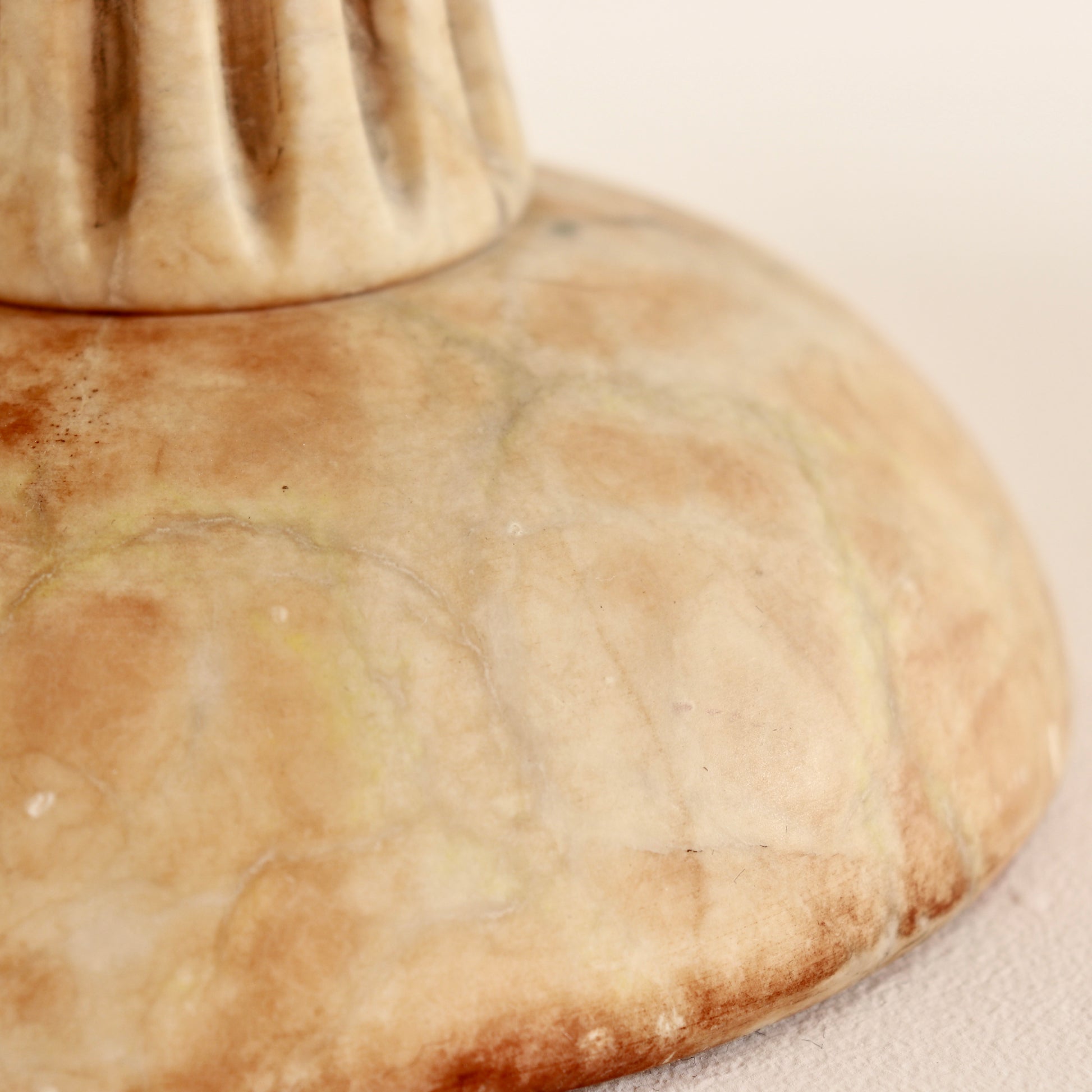 Domed alabaster base detail.