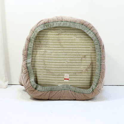 “Underside of chair with original Roset base cloth and label.”