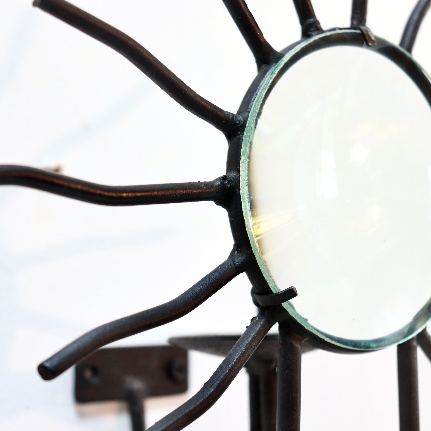 Sunburst wall sconces in the style of Andre Dubreuil
