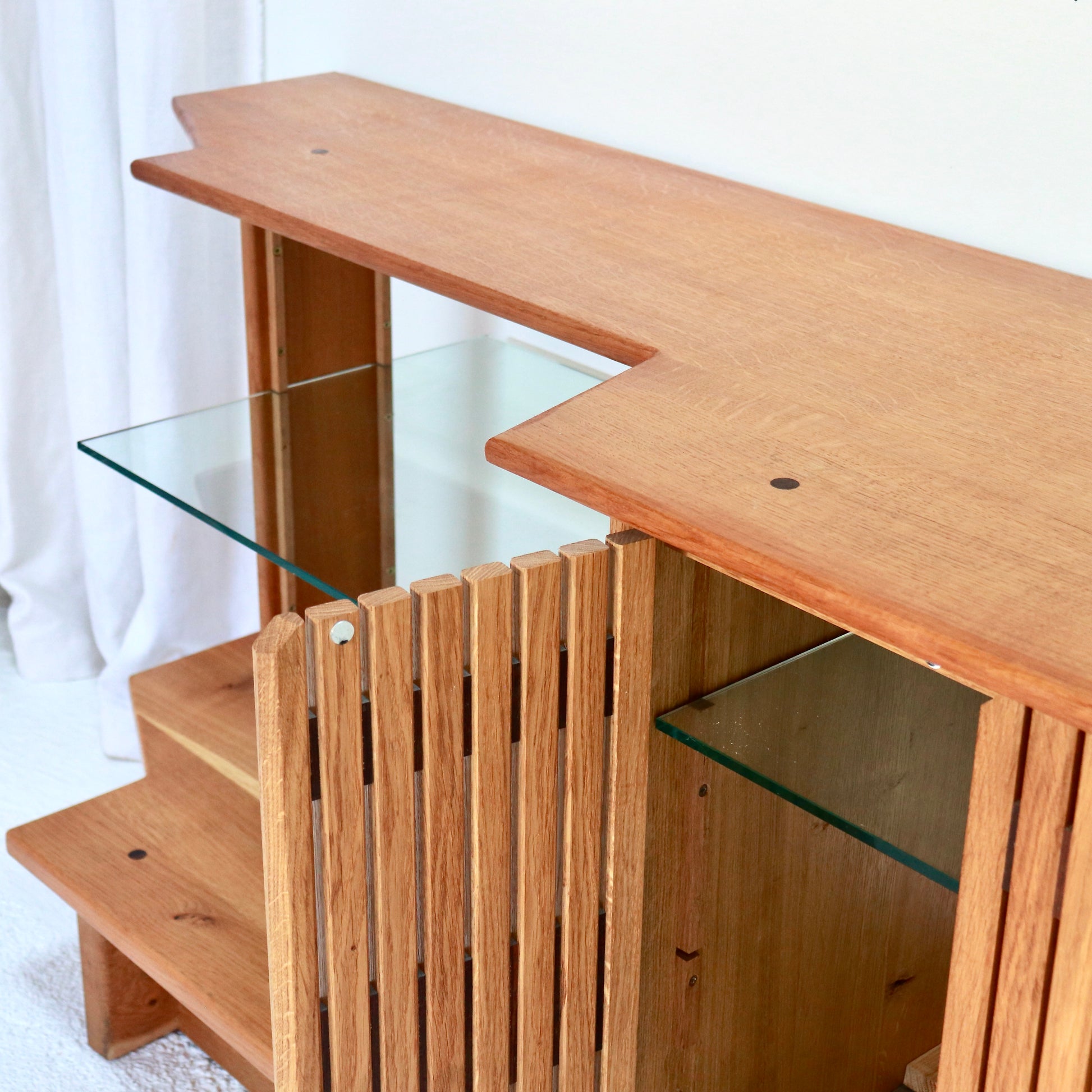 Vintage oak sideboard with glass shelf and modernist detailing