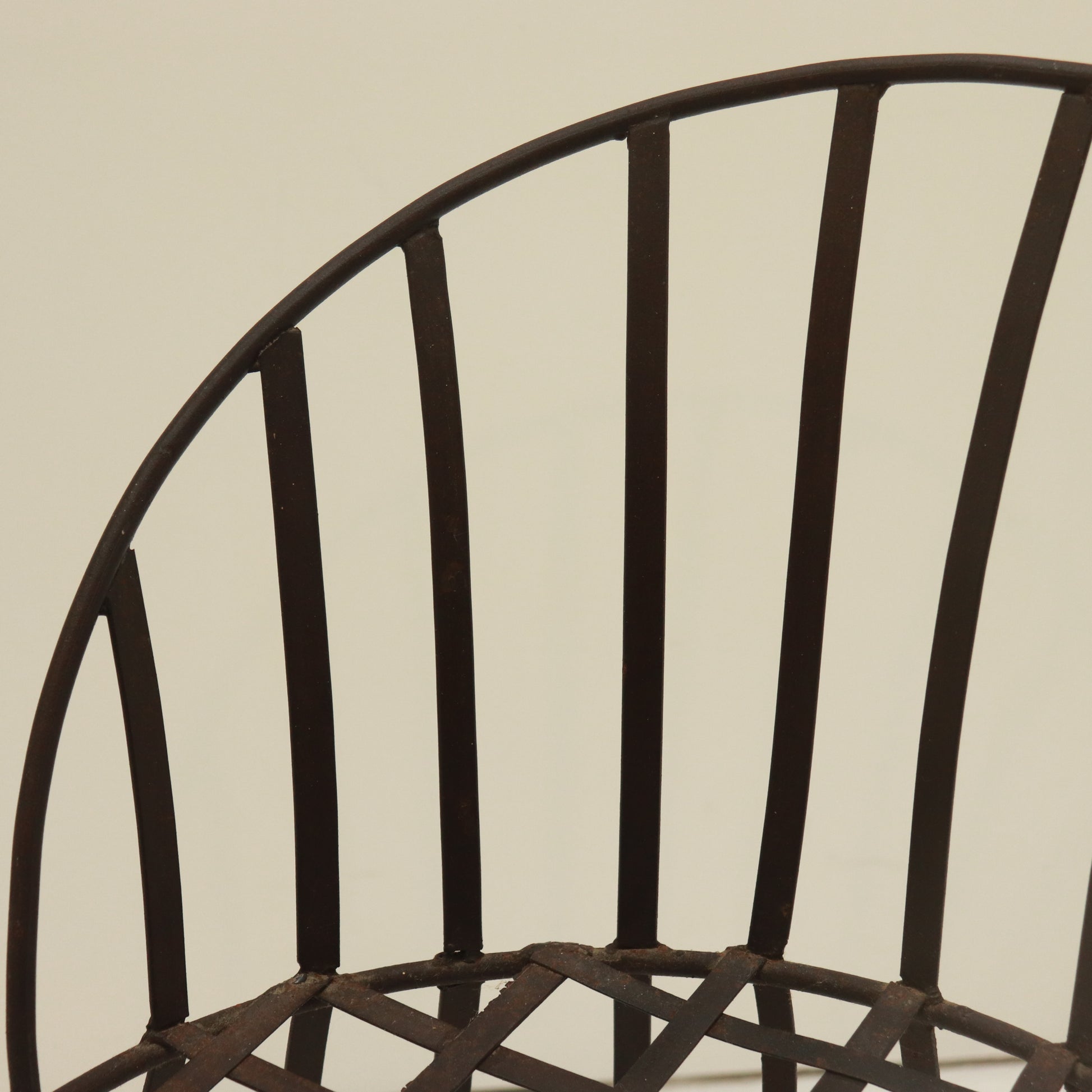 Top rail and backrest strap detail with aged surface.