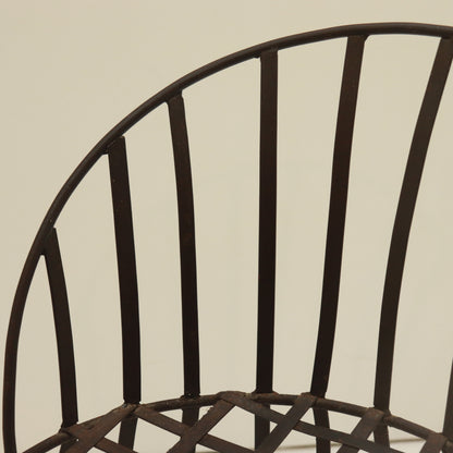 Top rail and backrest strap detail with aged surface.