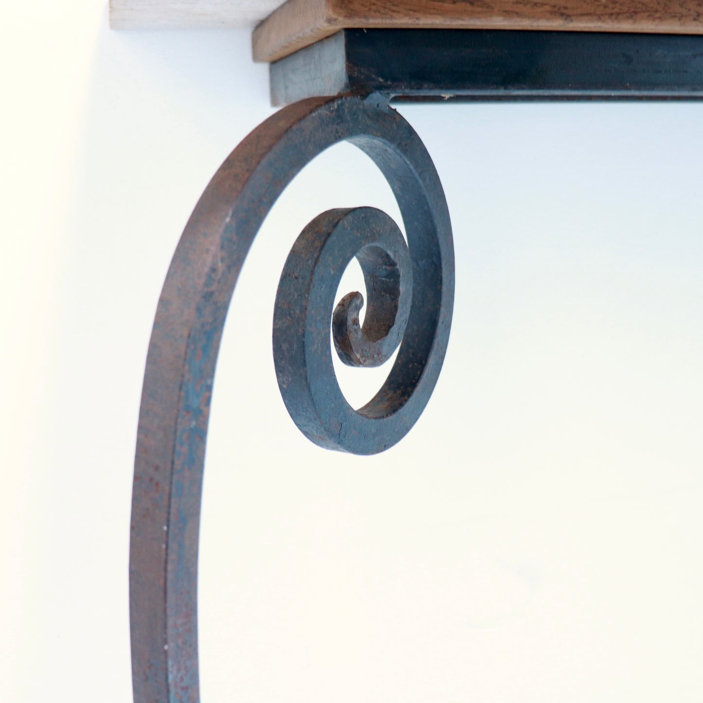 Side detail of travertine and iron junction