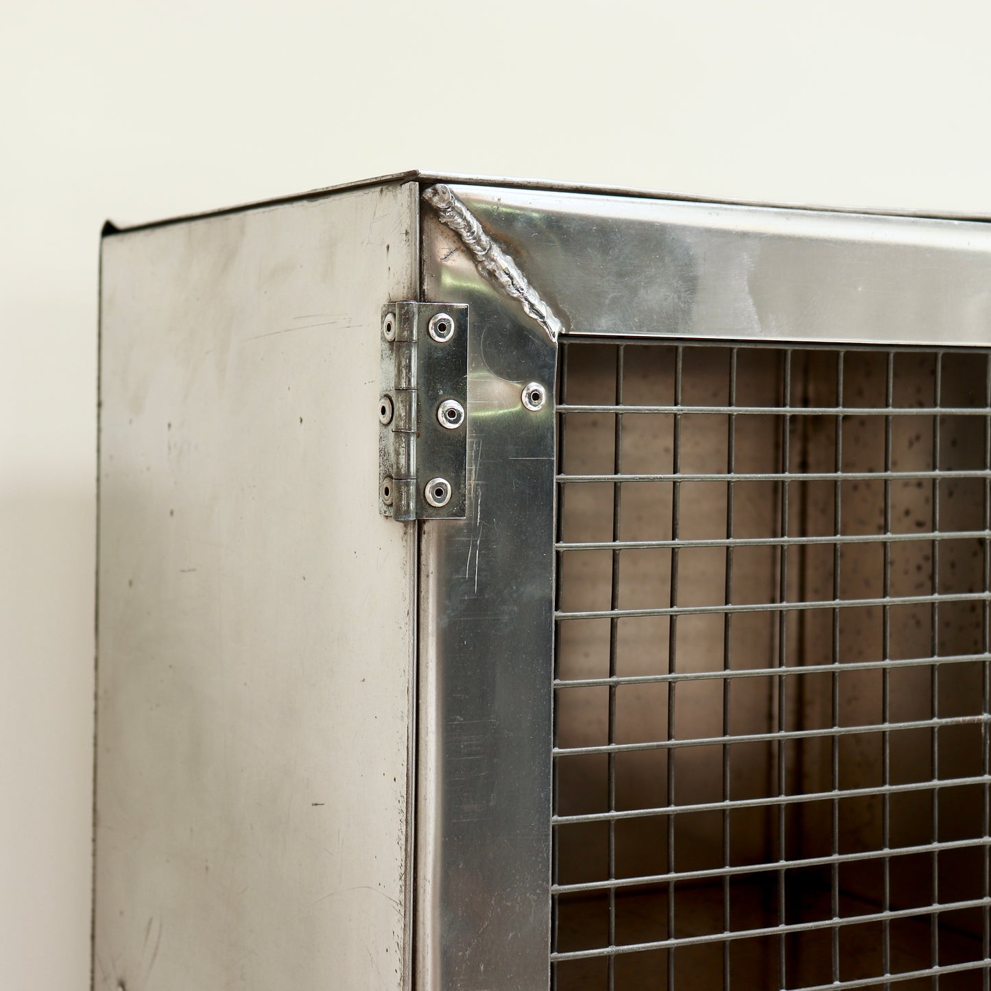 Detail of welded corner and steel mesh door.