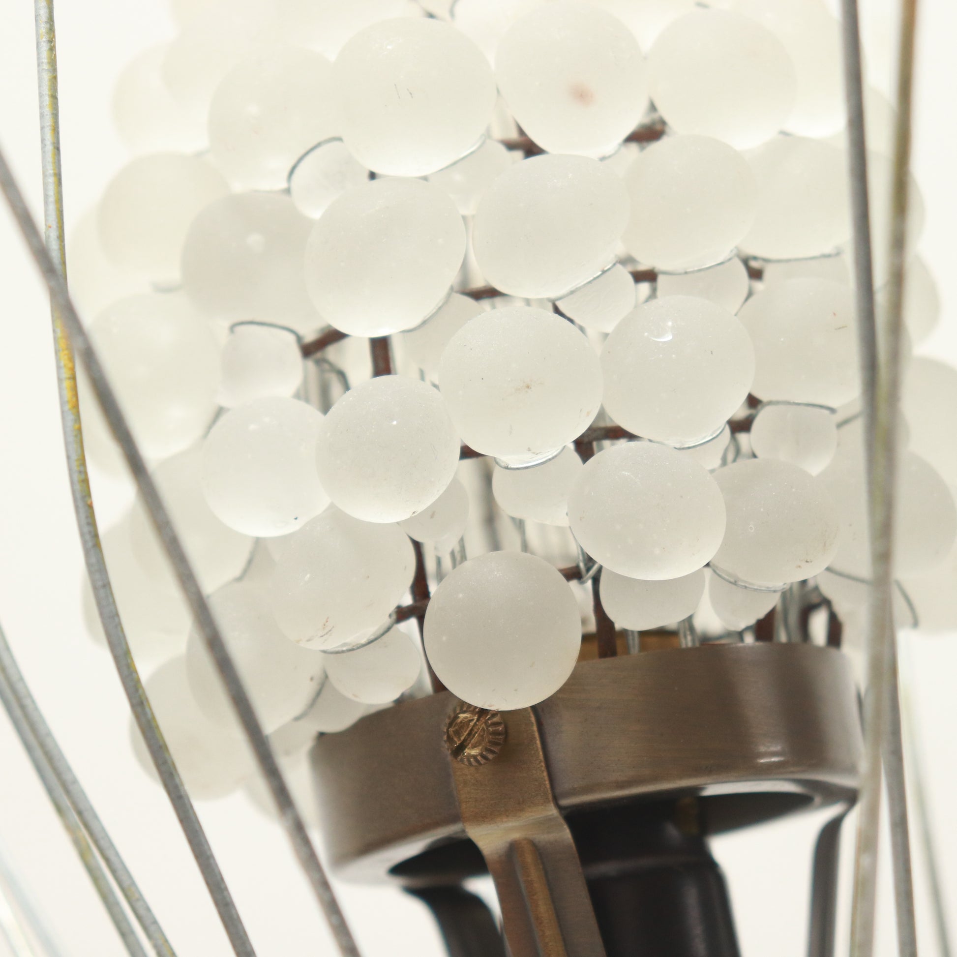 Close-up of glass cluster and lamp fitting