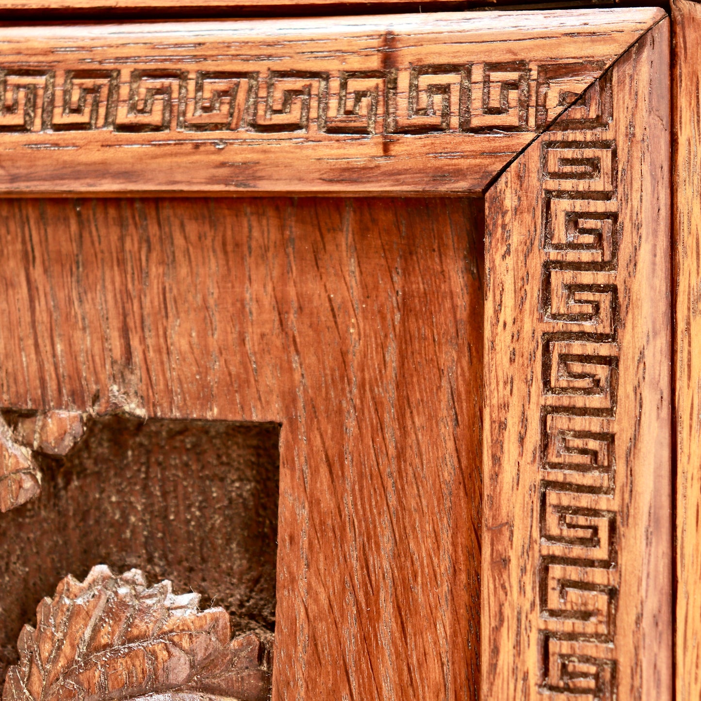 Close-up of carved wood grain and decorative border