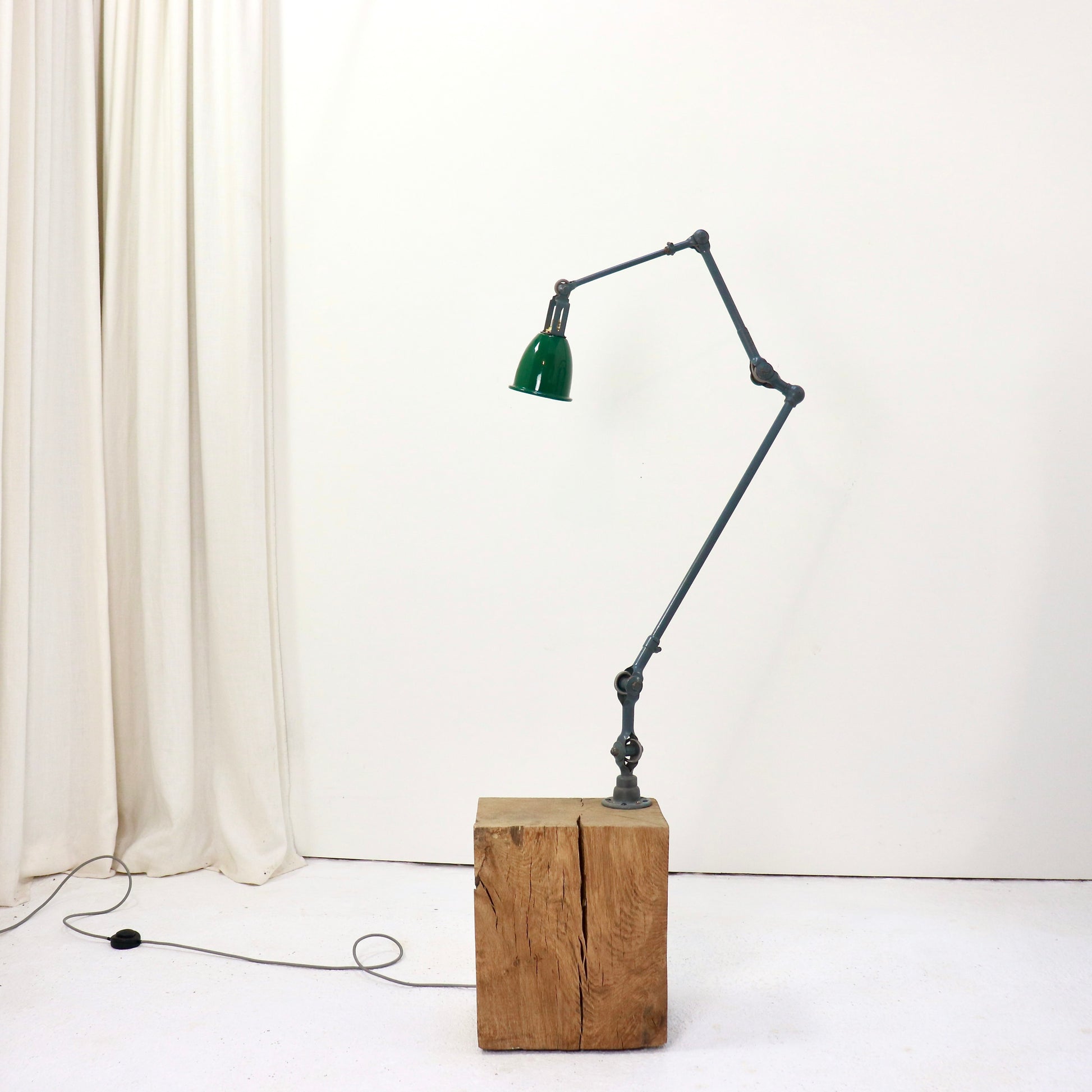 Adjustable workshop lamp with enamel shade and pivoting arm