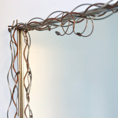 Decorative mirror with twisted copper and steel botanical frame