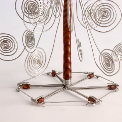 Copper coil bindings on handmade wire candle holder