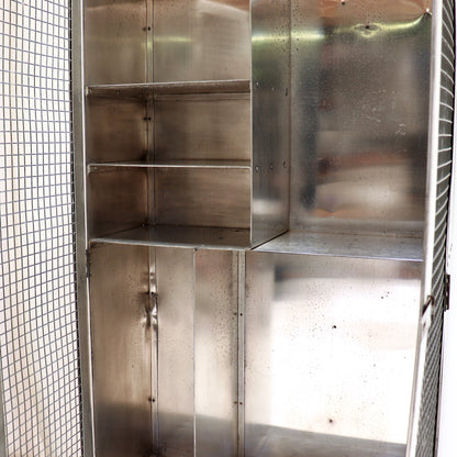 Interior shelving and storage compartments in aluminium cabinet.