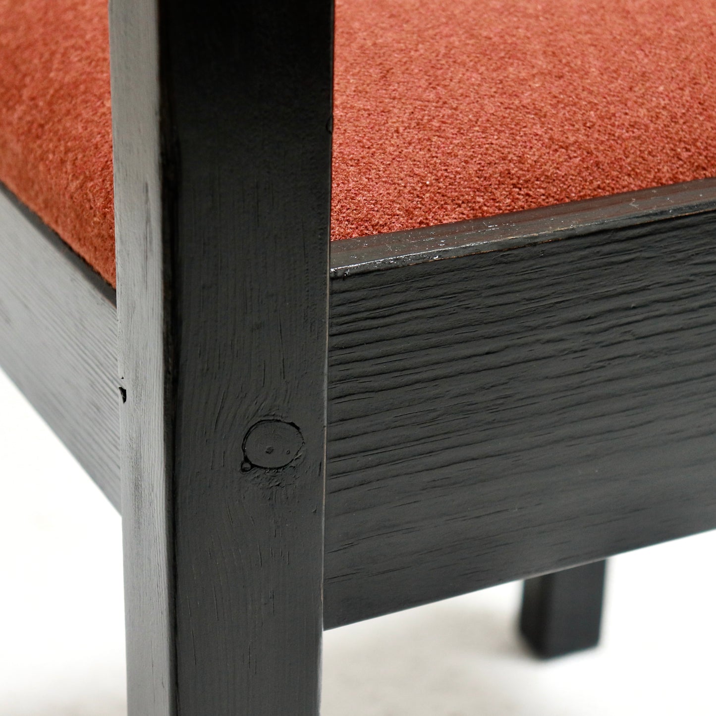 “Grain detail on ebonised pine frame of Danish chair”