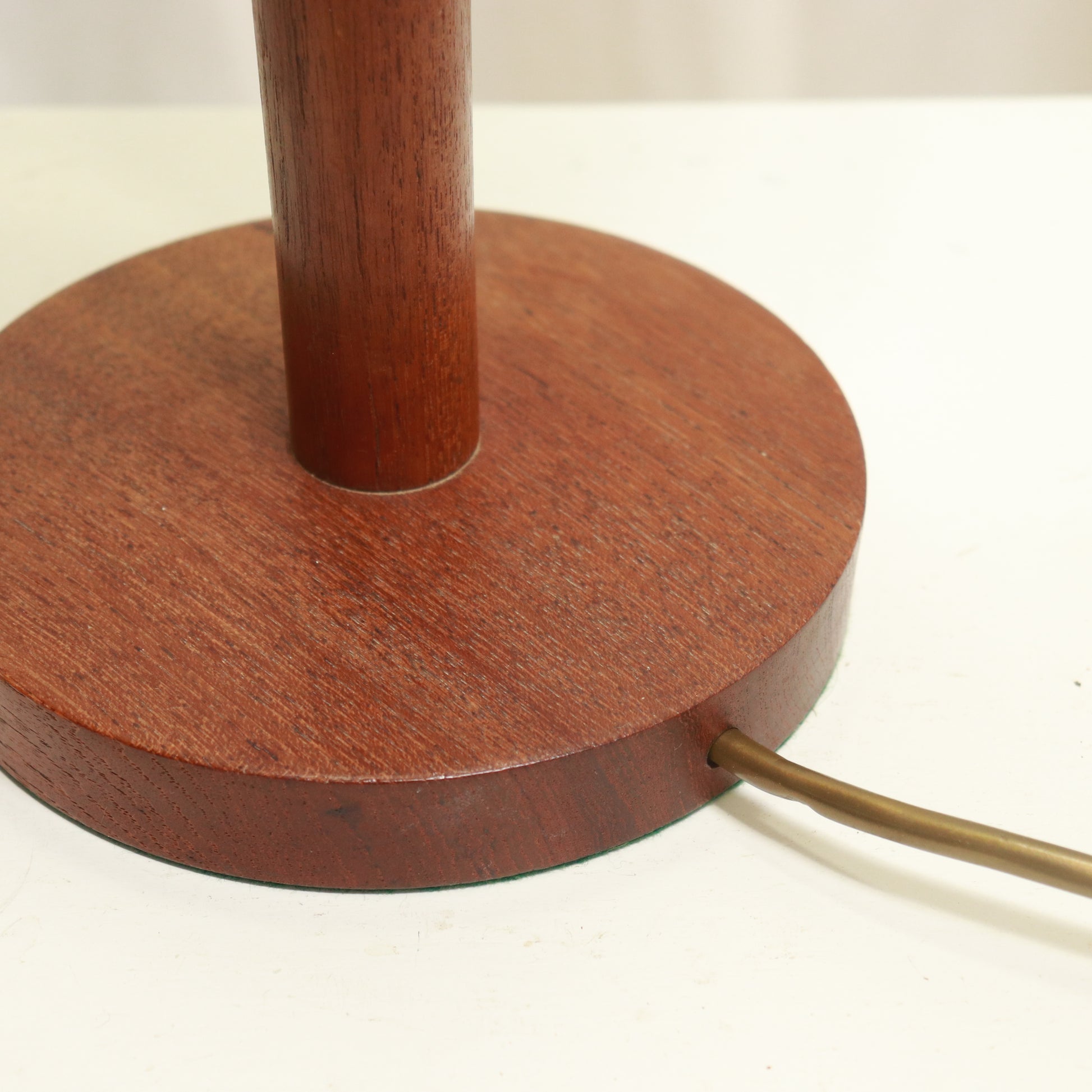 “Cable exit detail on teak lamp base”