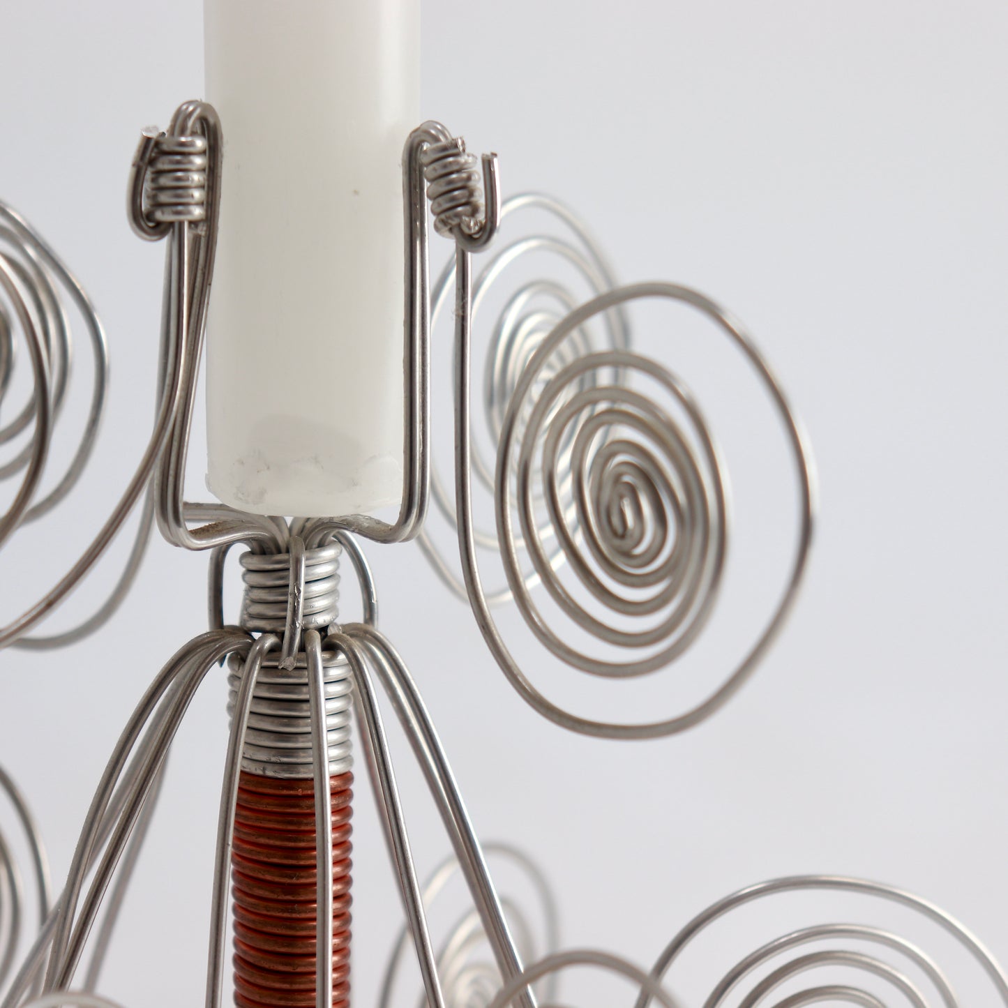 Close-up of spiral wire details on candle holder